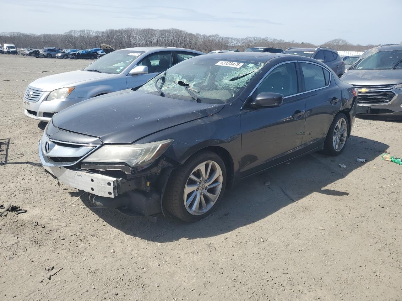 Copart front-left view showing windshield impact and missing front bumper cover at purchase.
