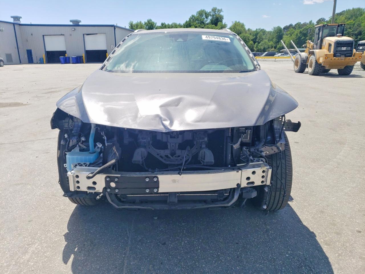Image of car showing frontend damage at auction.
