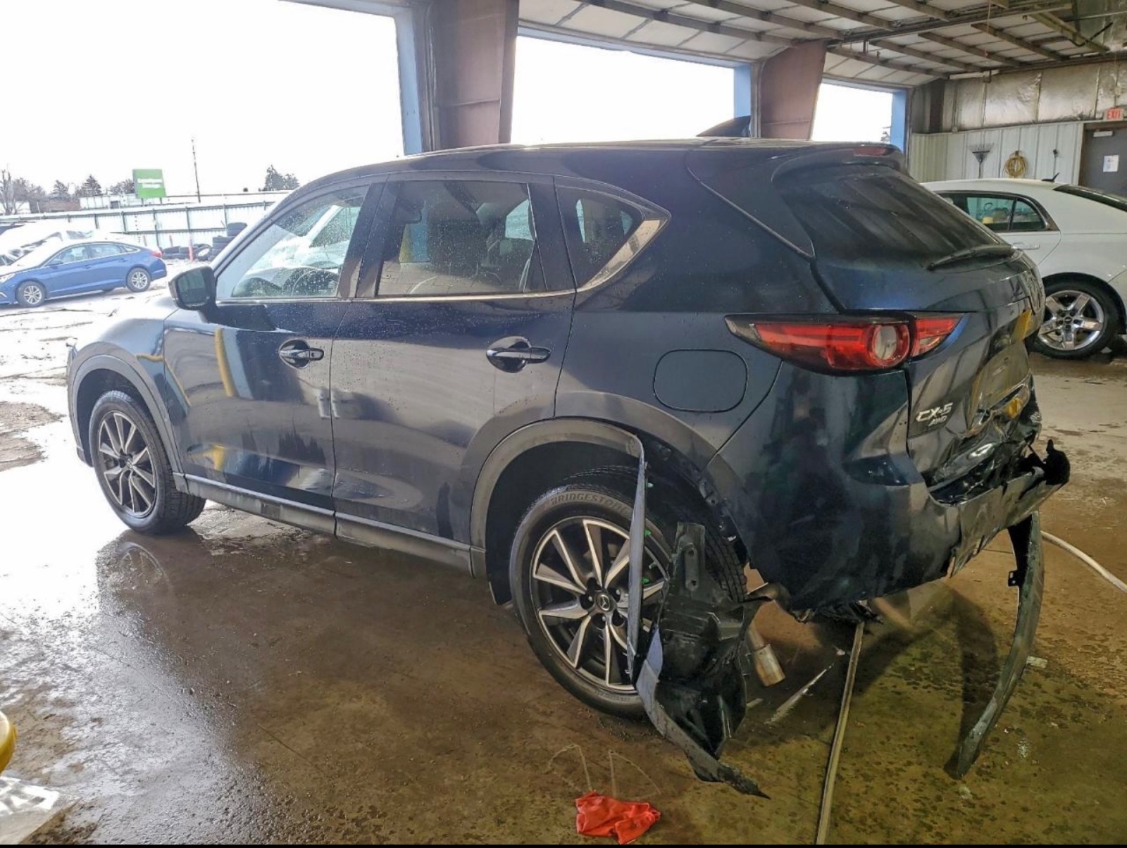 Vehicle at Copart Chicago South showing rear damage at auction.